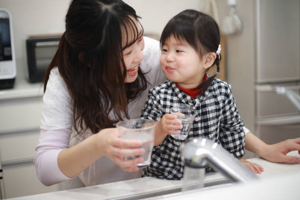 Parents and children drinking tap water